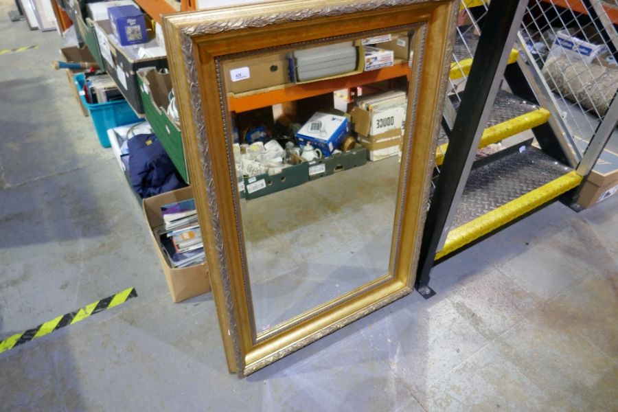 A gilt framed rectangular bevelled wall mirror