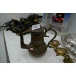 A brass and copper Islamic decorative coffee pot
