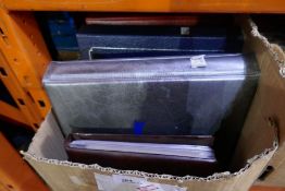 A box of mixed First Day Covers, in albums