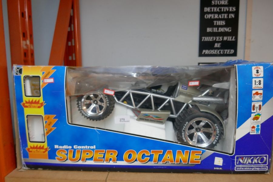 A Nikko 1/8th scale 9.6 volt radio controlled car boxed with controllers - Image 3 of 5