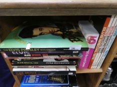 A selection of various annuals and books on Elvis Presley