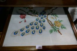 A collection of framed embroideries to include an oriental themed fire screen depicting a peacock