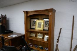 Waxed pine floor standing open bookcase with four shelves and carved cornice