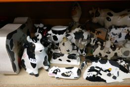 A quantity of model cows to include butter dishes, creamers, etc