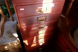 Narrow bank of 12 drawers with brass handles