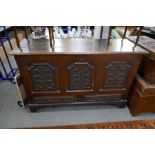 An antique oak mule chest with later carved panels, 145cm x 53cm
