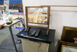 A small Panasonic TV and dressing table mirror