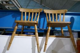 A set of four pine kitchen chairs