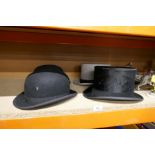 Two gentleman's bowler hats, one by Locke & Co, the other Dunn & Co, and two top hats