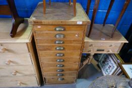 A vintage wax pine bank of collector's drawers graduated and stripped pine two drawer coffee table