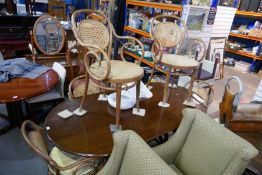 Large oval mahogany dining table on bentwood frame and a set of 6 bentwood and cane seat and back ar