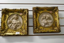 Two plaster relief pictures in gilt frames depicting cherubs, circumference of relief 17cm
