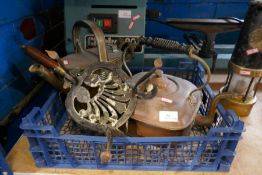 Crate containing brass kettle, iron stand and copper kettle