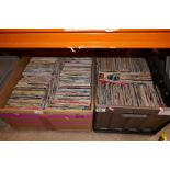 Four large boxes containing various single records various genres