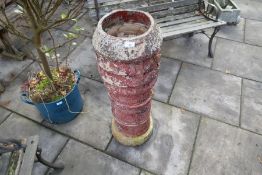 Tall terracotta chimney pot