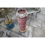 Tall terracotta chimney pot