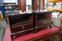 A pair of mahogany bedside tables each with a drawer by Stag and Stag mahogany nest of three tables