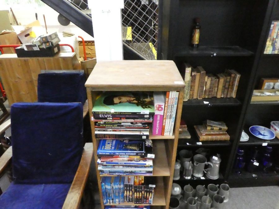 A narrow stripped pine four shelved open bookcase