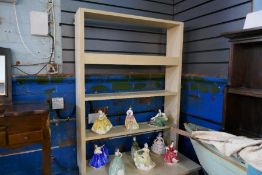 A cream painted kitchen dresser with open rack above 2 drawers and dressers
