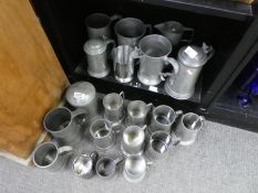 A collection of pewter tankards, jugs, etc some by quart