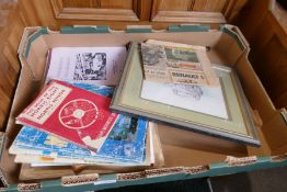 A box containing various Morris Minor ephemera and books
