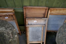 Large collection of antique washboards, copper dollies, stools etc, some branded