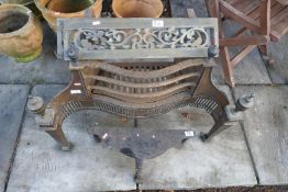 Antique wrought iron decorative fire grate, footman and brass fireplace inserts