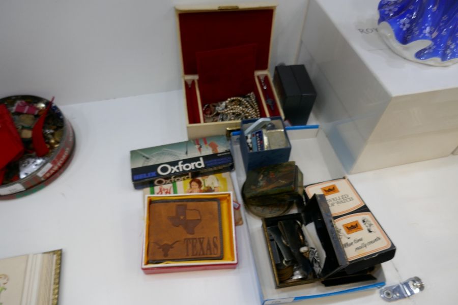 Collection of collectables including costume jewellery, small money tin, pen knives, etc