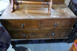 A vintage oak low boy with two short and 1 long drawer on turned supports
