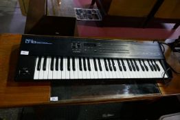 A Roland D10 Synthesiser with instructions