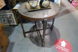A vintage circular tray top table, the top reverses into felt lined card table