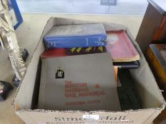 A box of ephemera, books, tea card albums, leather backed Queen's Regulations for Army 1868