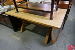 A rectangular waxed pine dining table on X frame and cross stretcher, 152cm