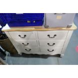 A modern cream finish chest of 6 small draws with stripped top 106cm