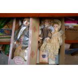 A box of mixed porcelain dolls, some boxed