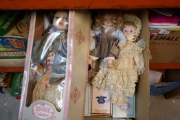 A box of mixed porcelain dolls, some boxed