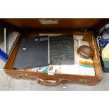 Leather suitcase containing ephemera including stamps, postcards etc