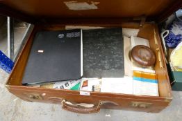 Leather suitcase containing ephemera including stamps, postcards etc