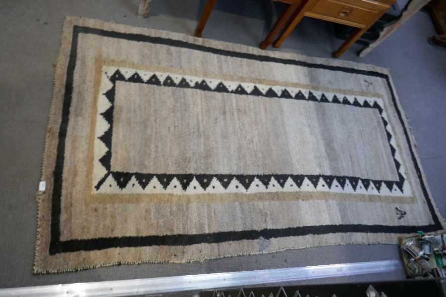 A Persian Tribal Gabbeh wool rug, 236x135cm