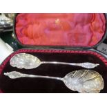 A mixed lot comprising of an ornate cased pair of spoons, Victorian with engraved floreated detail h