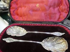 A mixed lot comprising of an ornate cased pair of spoons, Victorian with engraved floreated detail h