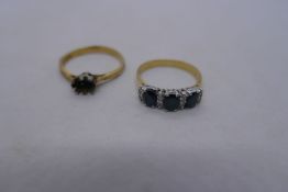 18ct yellow gold ring set with three oval sapphires separated with diamond chips, marked 750, Size P
