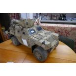 A remote control model of a British armoured vehicle modelled on Gulf War set up (highly de