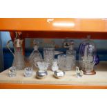 A set of mostly cut-glass including decanters, claret jug and an oil rig in a bottle