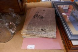 Set of newspapers reproduction with headlines including moon landing and the end of WWII