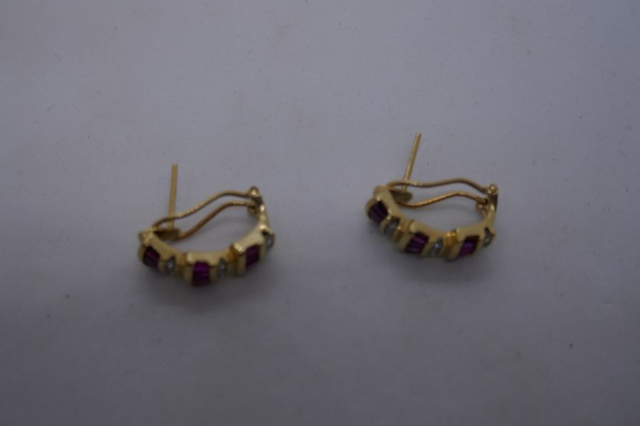 Pair of modern 14K yellow gold scalloped design stud earrings set with baguette cut rubies, separate - Image 6 of 8