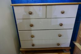 A modern cream painted two drawer wardrobe and modern chest of drawers