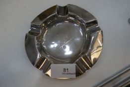 A silver ash tray hallmarked with a central cartouche. Slightly worn. 2.61ozt approx