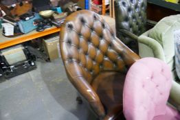 A reproduction button back swivel desk chair