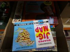 Four boxes of vintage games, jig saws etc
